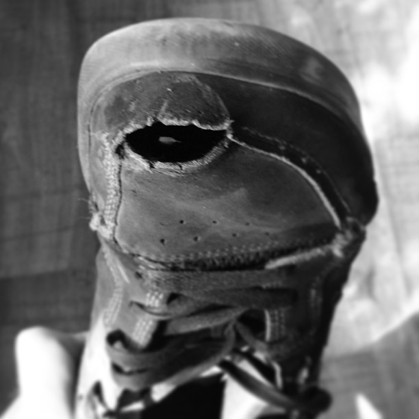 these shoes are made for walking — worn out with a hole through and through